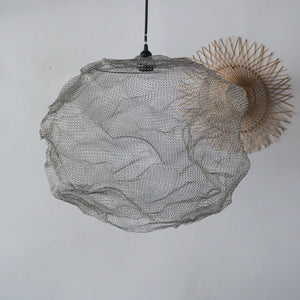 Handcrafted wire mesh pendant light with organic shape, minimalist decor background