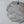 Handmade wire mesh pendant light with organic sculpted form against a plain background
