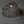 Handmade wire mesh pendant light with organic shape hanging from ceiling