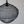 Handcrafted black wire pendant light with intricate mesh design against a plain wall