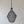 Handmade black wire pendant lamp with organic shape against neutral wall