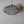Handcrafted wire mesh pendant light with intricate floral design, modern home decor accent