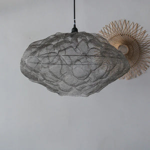 Handcrafted wire mesh pendant light with intricate floral design, modern home decor accent