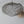 Handmade wire mesh ceiling lamp with organic shape on light background