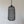 Handmade woven rattan pendant light with textured black finish against white wall