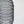Handcrafted black wire mesh pendant light with a spiral design against a white background.