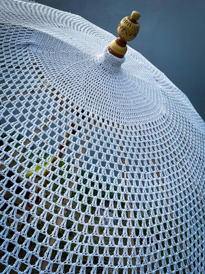 Handcrafted Balinese white crochet parasol with wooden finial, outdoor decor