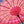 Pink Balinese umbrella interior showcasing intricate designs and vibrant colors, handmade in Bali, Indonesia.