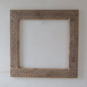 Hand carved ethnic mirror frame from Bali, Indonesia, featuring intricate motifs and 100% handmade craftsmanship.