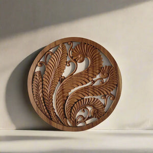 Hand-carved wooden wall art panel with intricate Balinese leaf patterns