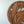 Hand-carved wooden wall art with intricate leaf design on a white background