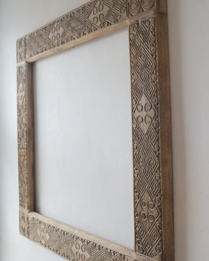 Hand carved ethnic mirror frame from Bali, Indonesia, showcasing intricate wood motifs and unique craftsmanship.