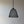Handmade black woven pendant light against a plain wall, modern boho home decor