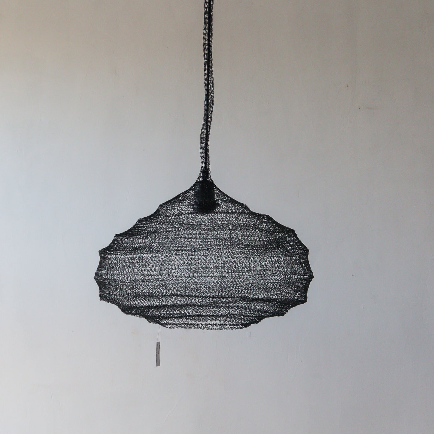 Black wire mesh chandelier with unique design, handcrafted in Bali, customizable for your decor needs.
