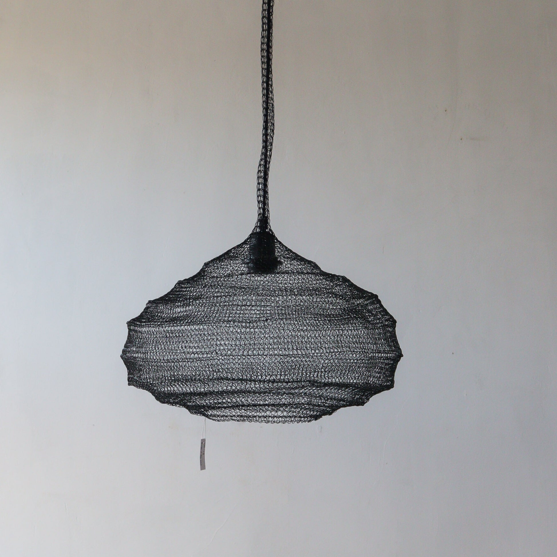Black wire mesh chandelier with unique design, handcrafted in Bali, customizable for your decor needs.