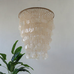 Handmade Balinese seashell chandelier with layered capiz shells, modern eco-friendly decor