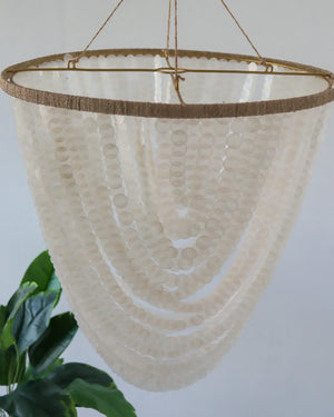 Handmade Balinese seashell chandelier with layered white beads, eco-friendly home decor
