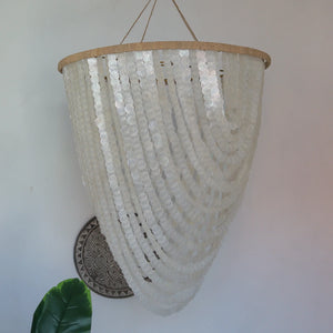 Handmade Balinese seashell chandelier with cascading white shells, modern boho decor