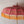 Balinese pink and gold hand-carved umbrella with yellow fringe and ornate patterns
