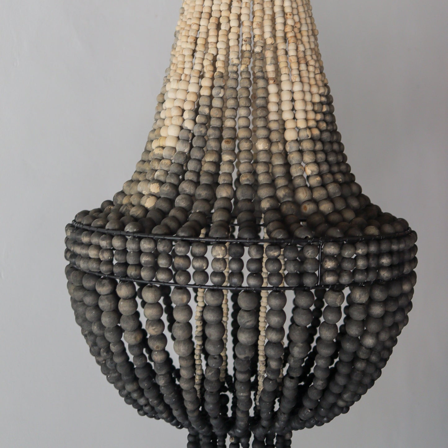 Beaded chandelier in ombre color, handcrafted in Bali, showcasing unique earthy tones and intricate design.