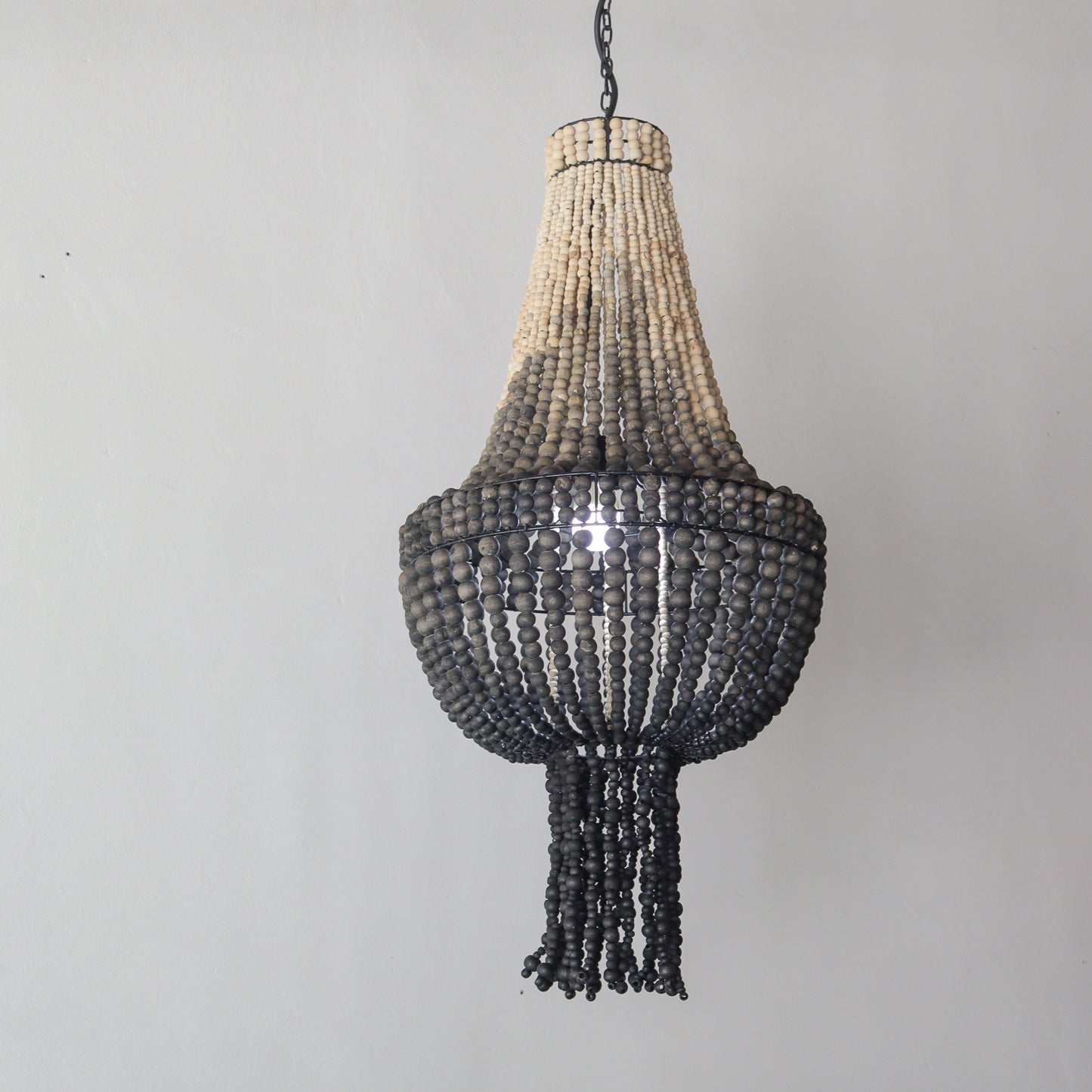Beaded chandelier with ombre color design, handcrafted in Bali, perfect for stylish home decor.