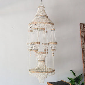 Handmade sea shell chandelier for pots decoration, crafted in Bali, Indonesia, featuring a unique design.