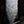 Handmade Balinese seashell chandelier with cascading white shell discs, outdoor setting