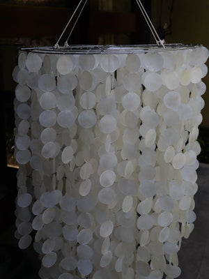 Handcrafted Balinese seashell chandelier with hanging round shells, eco-friendly decor