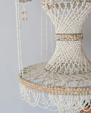 Handmade sea shell chandelier for pots decoration, crafted in Bali, featuring intricate beading and natural design.