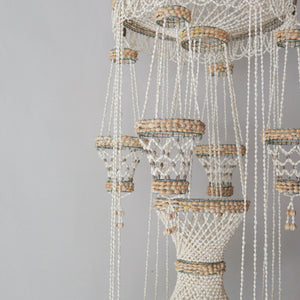 Handmade sea shell chandelier for pot decoration, crafted with natural materials in Bali, Indonesia.