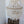 Handmade Balinese seashell chandelier with cascading white shell pendants in a minimalist room