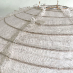 Handmade linen pendant light with frayed edges and natural jute hanging cord