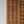 Hand-carved Balinese wooden door with geometric patterns and intricate border details