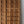 Hand-carved wooden door with geometric panels and intricate natural wood detailing