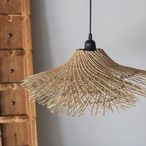 Handcrafted rattan pendant light with a tiered design, showcasing artisanal craftsmanship from Bali, Indonesia.
