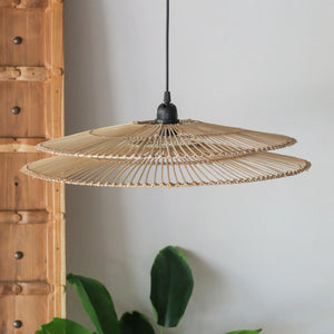 Handcrafted rattan pendant light with two-tiered design, showcasing unique Bali craftsmanship and natural variations.
