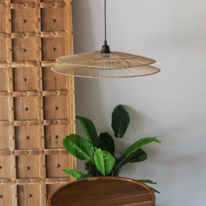 Handcrafted two-tier rattan pendant light, showcasing unique design and natural materials in a modern setting.