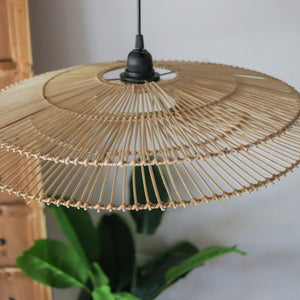 Handcrafted two-tiered rattan pendant light, showcasing intricate motifs and natural variations, perfect for unique home decor.