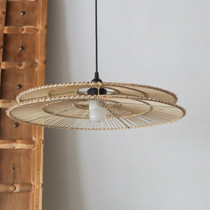 Handcrafted rattan pendant light with two-tiered design, showcasing unique Balinese craftsmanship and intricate details.