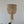 Handmade Balinese beaded seashell chandelier with natural neutral tones, hanging indoors