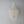 Handmade Balinese seashell chandelier with cascading beaded strands against a gray wall