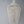 Handmade Balinese seashell chandelier with cascading beads against a plain wall