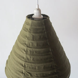 Handmade olive green fabric pendant lampshade with textured stitching, minimalist lighting