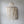 Handmade Balinese seashell chandelier with layered draped beads against a neutral wall
