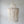 Handmade Balinese seashell chandelier with cascading beads against a neutral wall