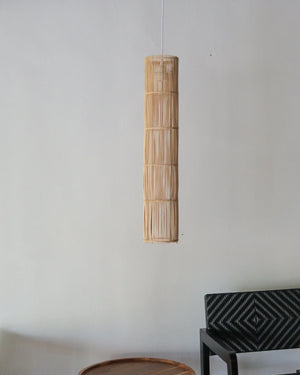 Handcrafted rattan pendant light in tube design, showcasing unique patterns and natural variations, perfect for any decor.