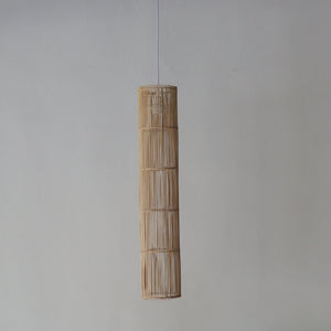 Handcrafted rattan pendant light in tube design, showcasing unique Bali artisan craftsmanship.