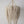 Beaded chandelier in white and gold, handcrafted decor from Bali, Indonesia, perfect for any elegant room.