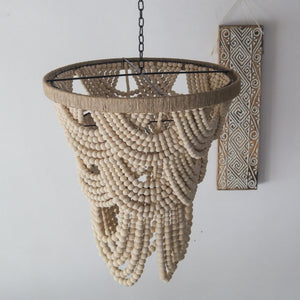 Handmade wooden bead chandelier with hanging tribal wall art, bohemian home decor