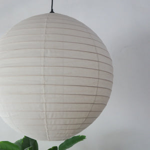 Off-white linen lantern chandelier in round shape, handcrafted in Bali, perfect for elegant home decor.